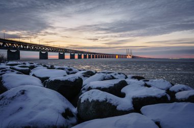 Snow covered boulder by the Øresund Bridge