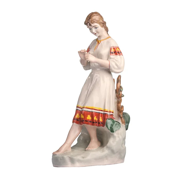 Фарфоровые статуэтки девушка изолированы на белом — стоковое фото