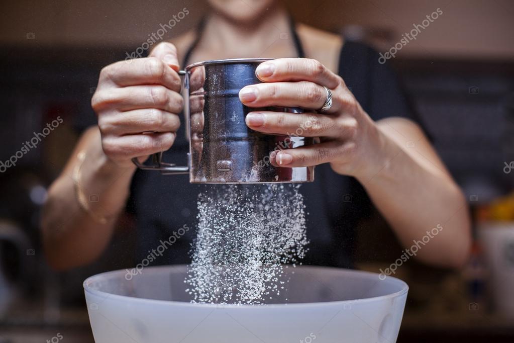 Sifting flour — Stock Photo © ulldellebre 24841953