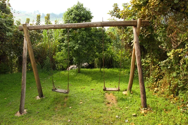 Rustic Wooden Swing Set Stock Picture