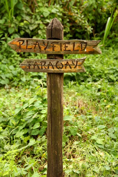 Wooden Sign to Playfield and Faraway — Stock Photo, Image