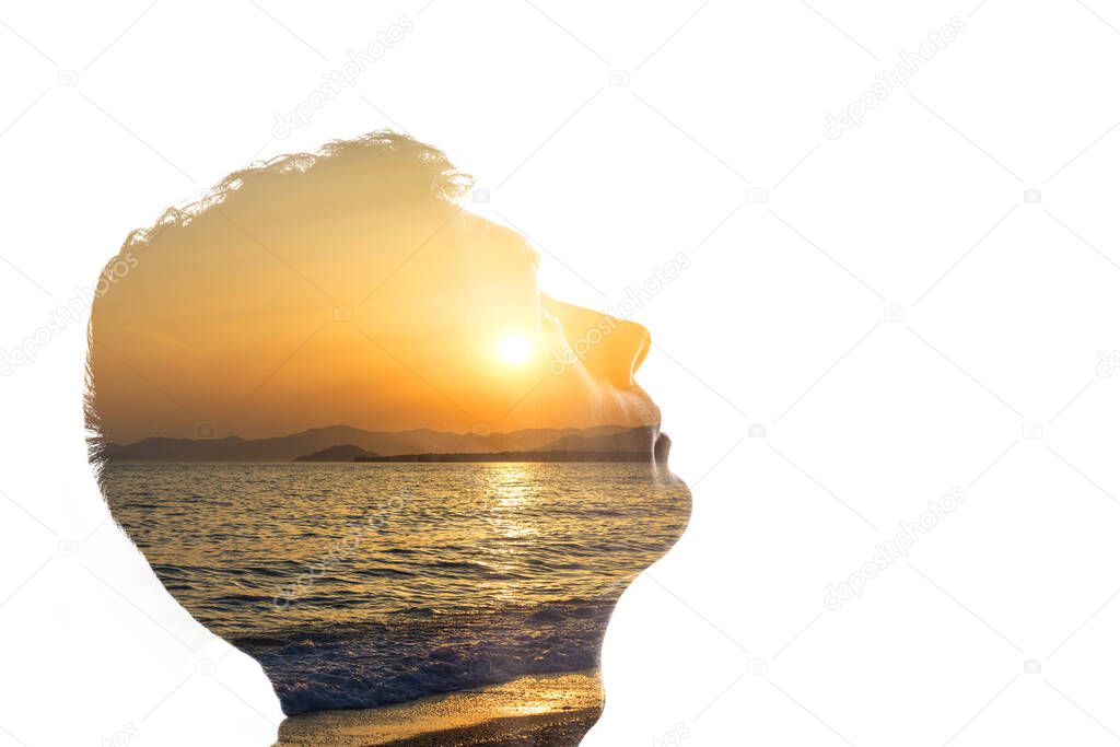 Isolated combination of the silhouette of a man face and a seascape with a sunset. Concept of unity of nature and people, inner peace, caring for the environment