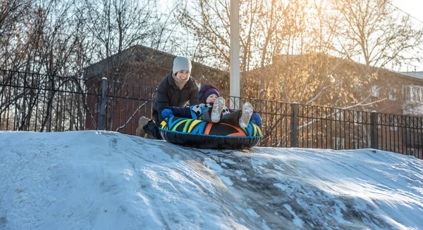 Happy Child His Mother Tubing Park Slide Fun Winter Weekend — Stock fotografie
