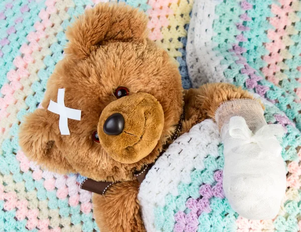 Teddy with bandage Royalty Free Stock Photos