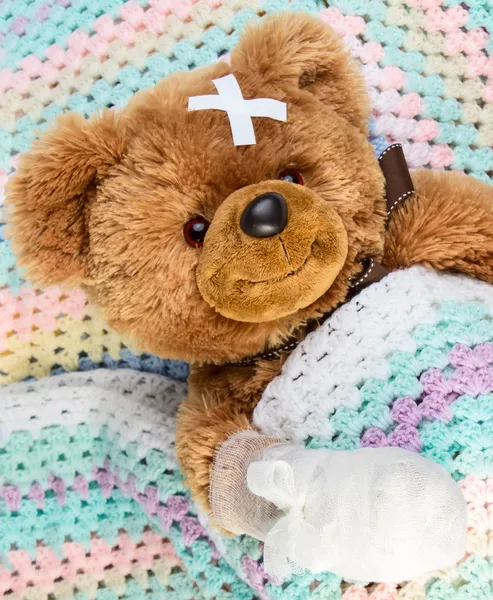 Teddy with bandage Stock Picture