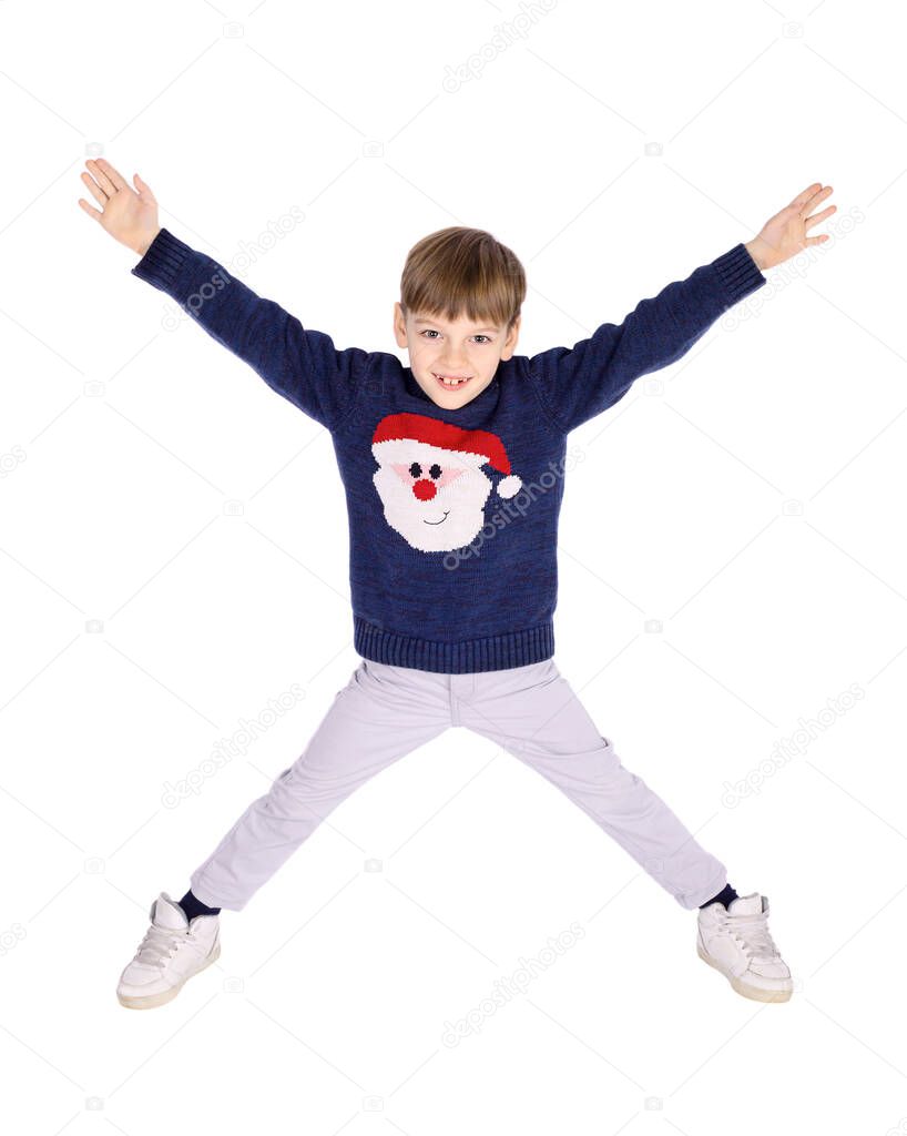 Portrait of little boy posing for studio shot in Christmas time