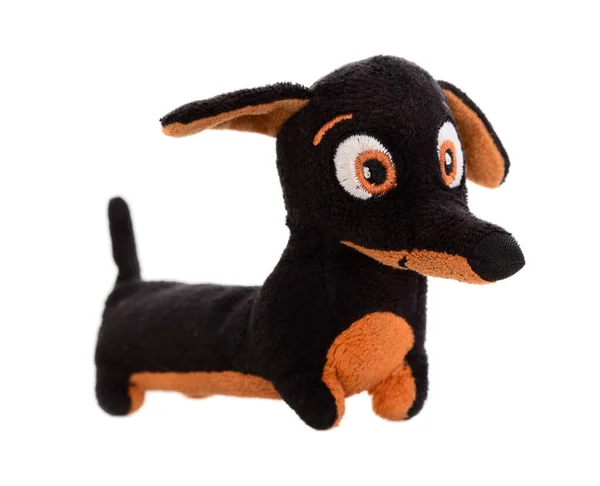 白色背景下隔离的软玩具黑色的腊肠狗 — 图库照片