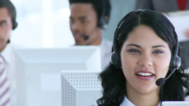 Businesswoman in a call center with her team — Stock Video
