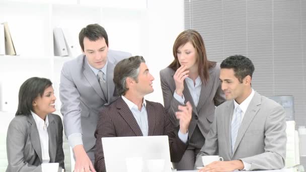 Business team applauding a colleague in office — Stock Video