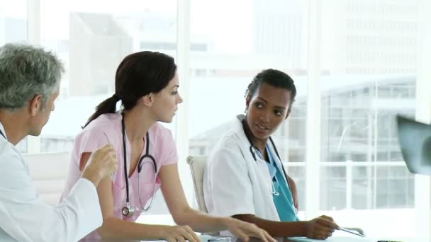 Confident medical team examining a x-ray — Stock Video