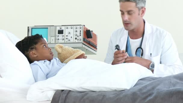 Confident doctor checking his patient's ears — Stock Video