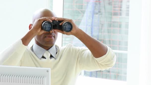 Ethnic businessman looking through binoculars — Stock Video