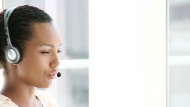 Enthusiastic businesswoman with headset on — Stock Video