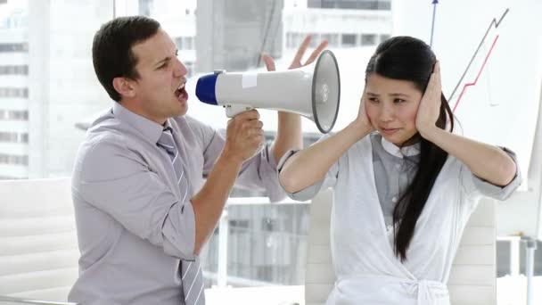 Caucasian businessman yelling through a megaphone — Stock Video