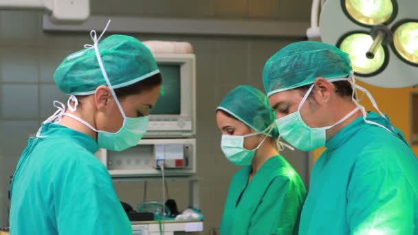Serious surgeons operating — Stock Video