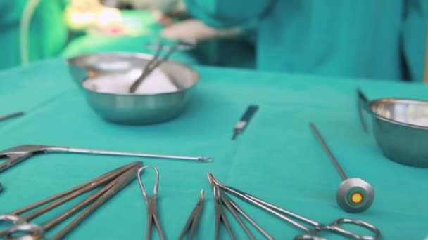 Female patient lying on a table undergoing surgery — Stock Video