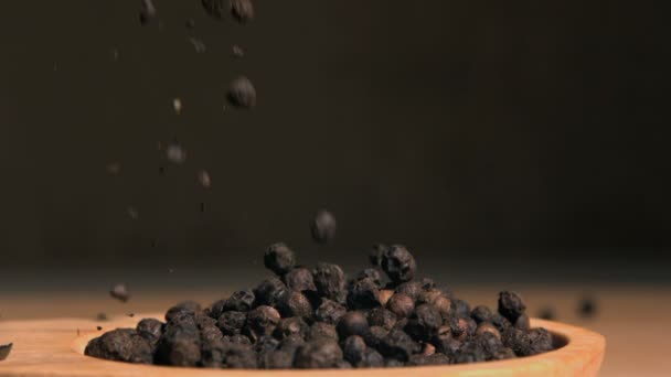 Peppercorns falling in super slow motion — Stock Video