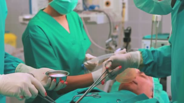 Surgeons operating with surgical tools — Stock Video