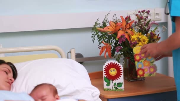 Doctor placing a finger on baby sleeping — Stock Video