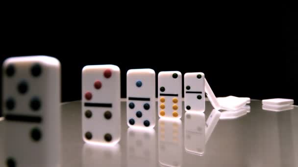 Dominoes toppling over in sequence — Stock Video