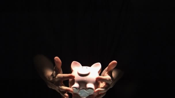 Mans hands throwing pink piggy bank — Stock Video