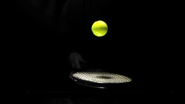 Tennis ball bouncing on a racket — Stock Video