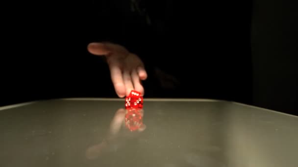 Hand throwing two red dice — Stock Video