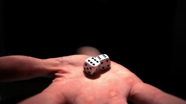 Hands grasping white dice — Stock Video