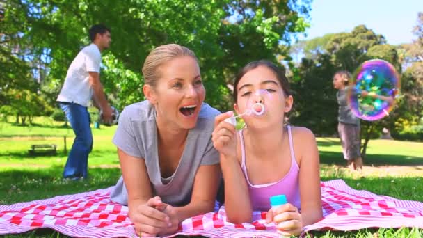 Young couple playing with their two children — Stock Video