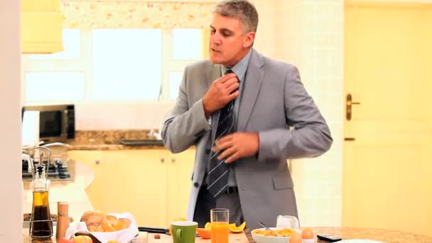 Businessman in suit hurriedly taking his breakfast — Stock Video