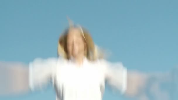 Blonde Woman jumping on a trampoline — Stock Video