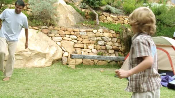 Father and son playing football — Stock Video