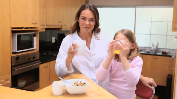 Peaceful mother and daughter drinking — Stock Video