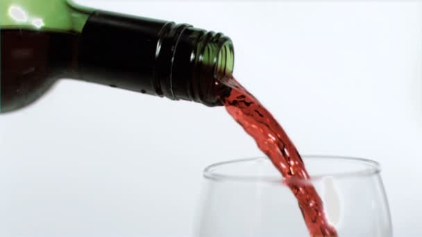 Red wine being poured in super slow motion — Stock Video
