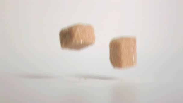 Sugar cubes falling down in super slow motion — Stock Video