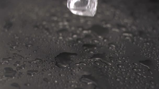 Ice cubes hitting ground in super slow motion — Stock Video