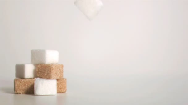 Sugar cubes falling down in super slow motion — Stock Video
