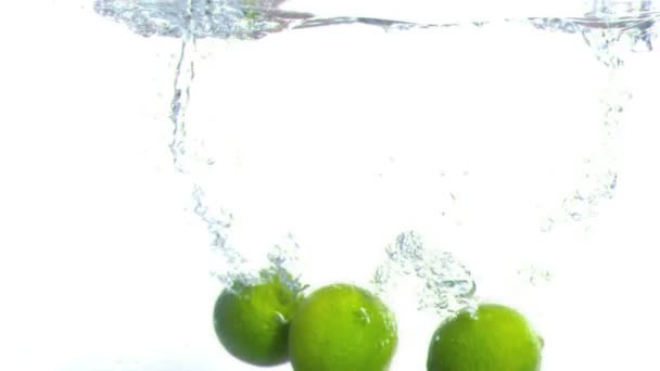 Lime falling into water in super slow motion — Stock Video