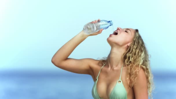 Blonde woman drinking water in slow motion — Stock Video