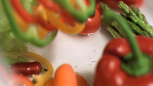 Sliced peppers dropping in super slow motion — Stock Video