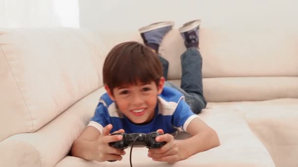 Boy playing videos games — Stock Video