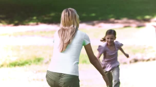 Mother in slow motion holding her daughter — Stock Video