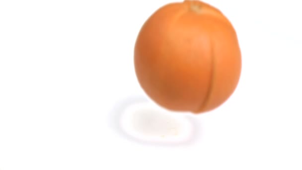 Sliced orange falling in super slow motion — Stock Video