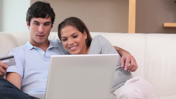 Couple using a credit card — Stock Video