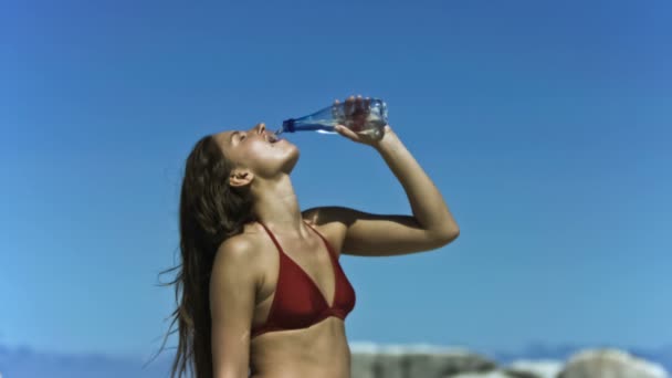 Brunette drinking water in slow motion — Stock Video