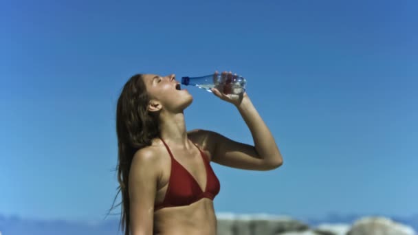 Young woman refreshing in slow motion — Stock Video