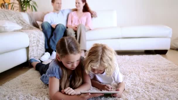 Children using a tablet computer — Stockvideo