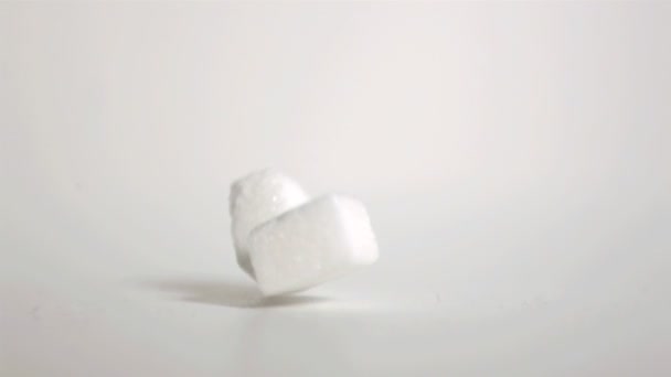 Sugar cubes falling down in super slow motion — Stock Video