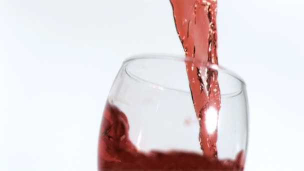 Red wine being poured in super slow motion — Stock Video