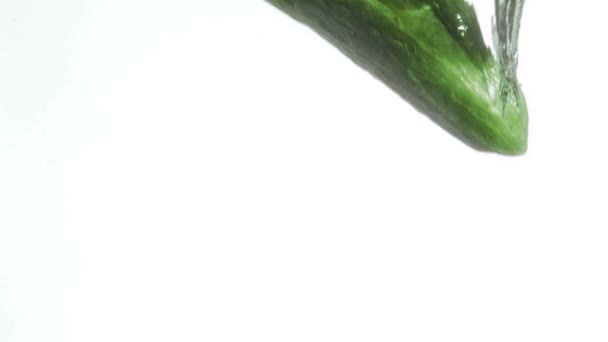 Cucumber in super slow motion dropping — Stock Video